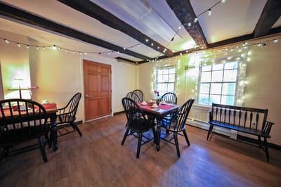 Cozy dining area with tables and string lights
