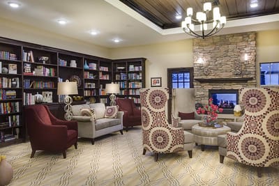 Cozy common area with comfortable seating and bookshelves