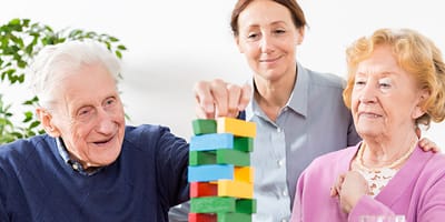 Parker at Monroe, nursing home in Monroe Township, NJ — Seniors enjoying a game of Jenga together