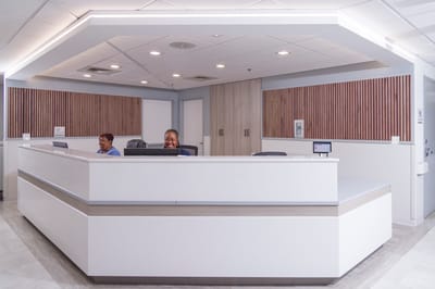 Reception area with staff at the front desk