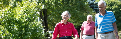 Residents enjoying a walk in a garden area
