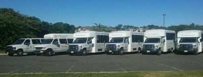 Facility transport vehicles lined up in parking lot