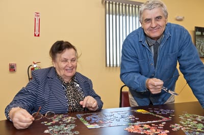Residents enjoying a puzzle activity indoors