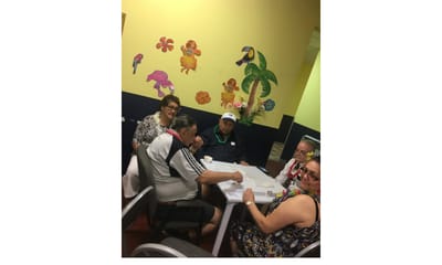 Residents enjoying an activity in a colorful room