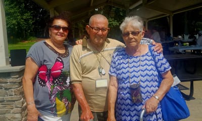 Residents posing together in an outdoor area