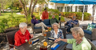 Residents enjoying an outdoor game in a garden