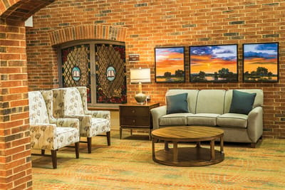 Cozy common area with seating and artwork