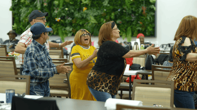 Residents enjoying a lively activity in a common area