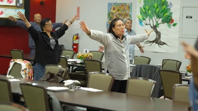 Residents participating in an exercise activity in the dining area