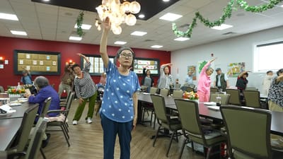Residents participating in a group activity in the common area