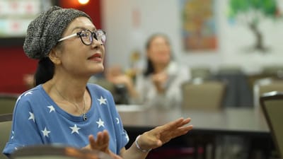 Resident enjoying an activity in a common area