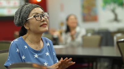 Resident enjoying a social atmosphere in an activity room