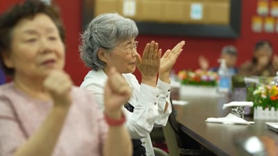 Residents engaging in an activity and applauding