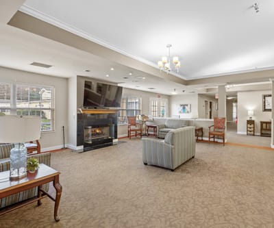 Bright common area with seating and fireplace