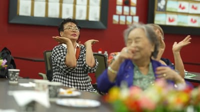 Residents engaged in a joyful activity during a group event