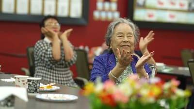 Residents participating in an engaging activity in a common area