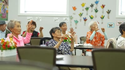 Residents engaged in a seated activity in a common area