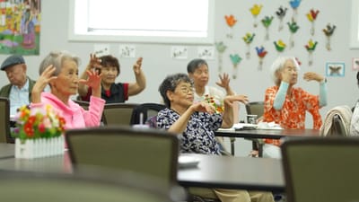 Residents participating in a seated activity session