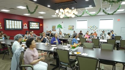 Residents participating in a group activity in a common area