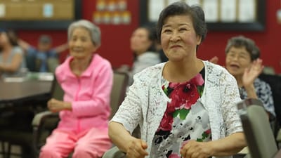 Residents enjoying a group activity in a lively social setting