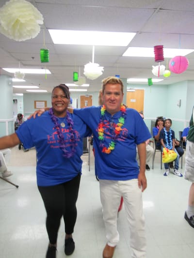 Staff and residents celebrating together in a common area