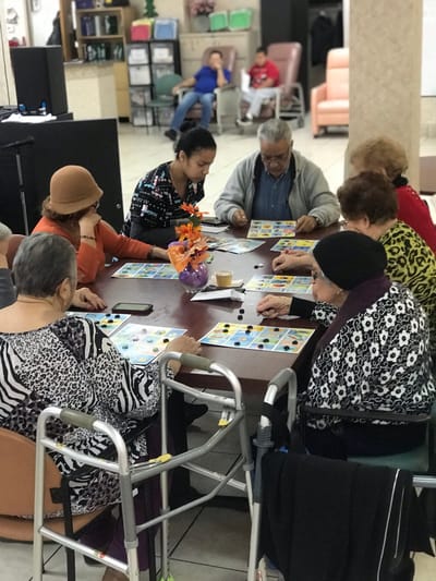 Residents playing bingo in a common area