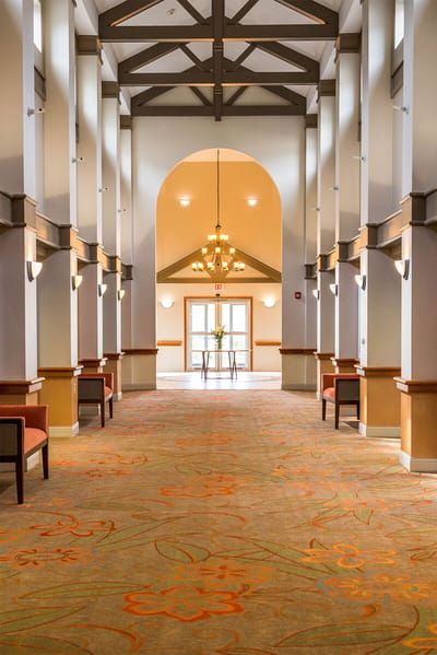 A well-lit hallway in a senior living facility