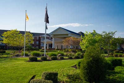 Exterior view of Applewood Village with landscaping