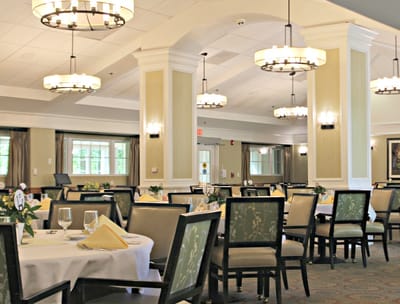 Bright dining room with tables set for meals