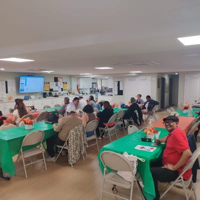 Residents and staff engaged in an activity in a common area
