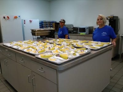 Catering staff preparing meals in the kitchen