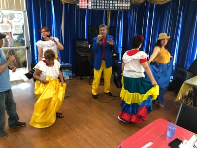 Residents participating in a lively dance performance at the facility