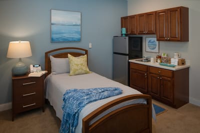 Cozy private room with bed and kitchenette