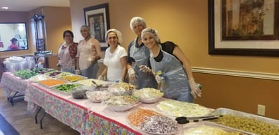 Staff preparing food in a communal kitchen area