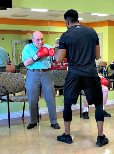 Residents participating in a boxing training session