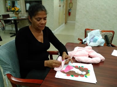 Resident engaging in a creative activity indoors