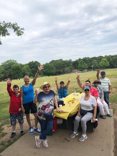 Residents enjoying an outdoor activity during a gathering