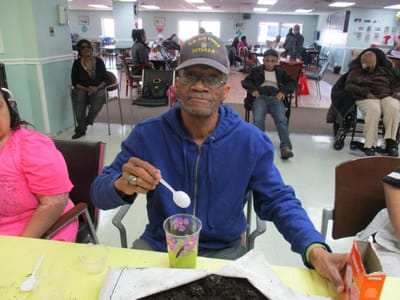 Resident engaged in an activity in a common area