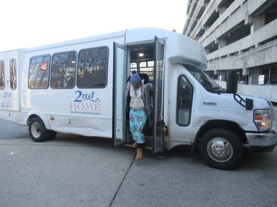Resident exiting the facility transport vehicle