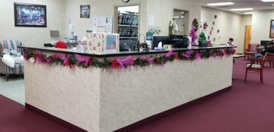 Interior view of a facility lobby decorated for the holidays