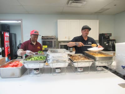 Staff serving meals in the dining area