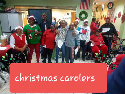 Residents singing in a festive Christmas celebration