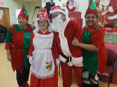 Residents and staff celebrating in festive costumes