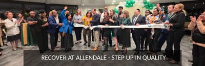 Residents and staff celebrating at a ribbon-cutting event.