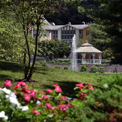 Exterior view of the facility with garden and gazebo