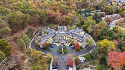 Aerial view of Victoria Mews Assisted Living surrounded by colorful trees