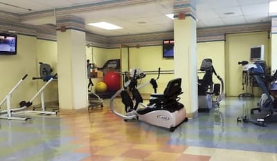 Interior view of a gym with workout equipment