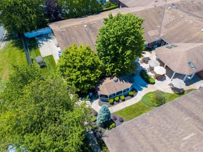 Aerial view of an outdoor space with trees and seating