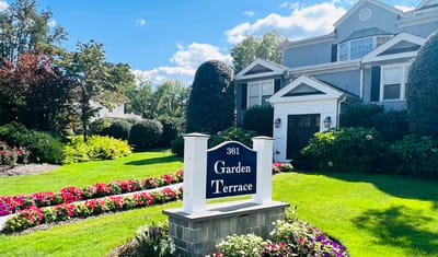 Exterior view of Garden Terrace Nursing Home sign and landscaping