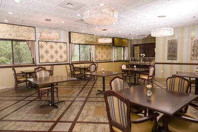 Interior dining room with tables and chandeliers